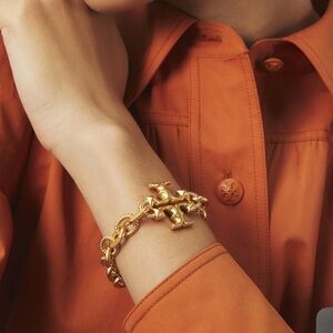 Tory Burch NWT Torsade engraved Gold Bracelet with Dust Bag.